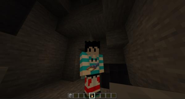 The player holds a torch in his hand, creating good lighting in Minecraft
