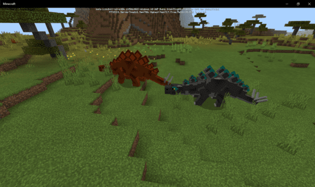 Two different colors of stegosaurs