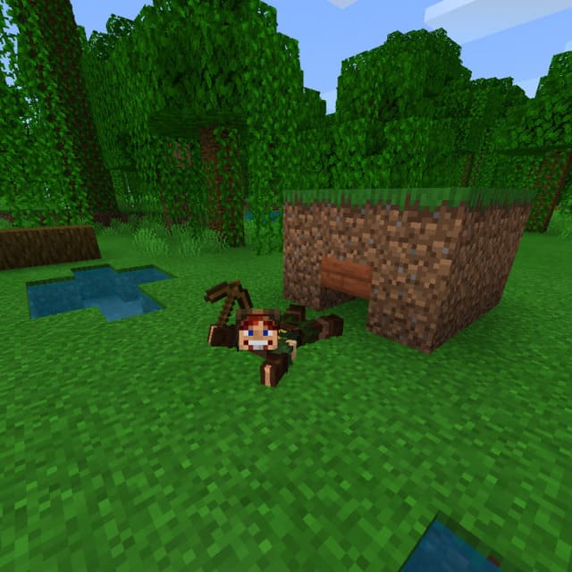 The player crawls and holds the pickaxe